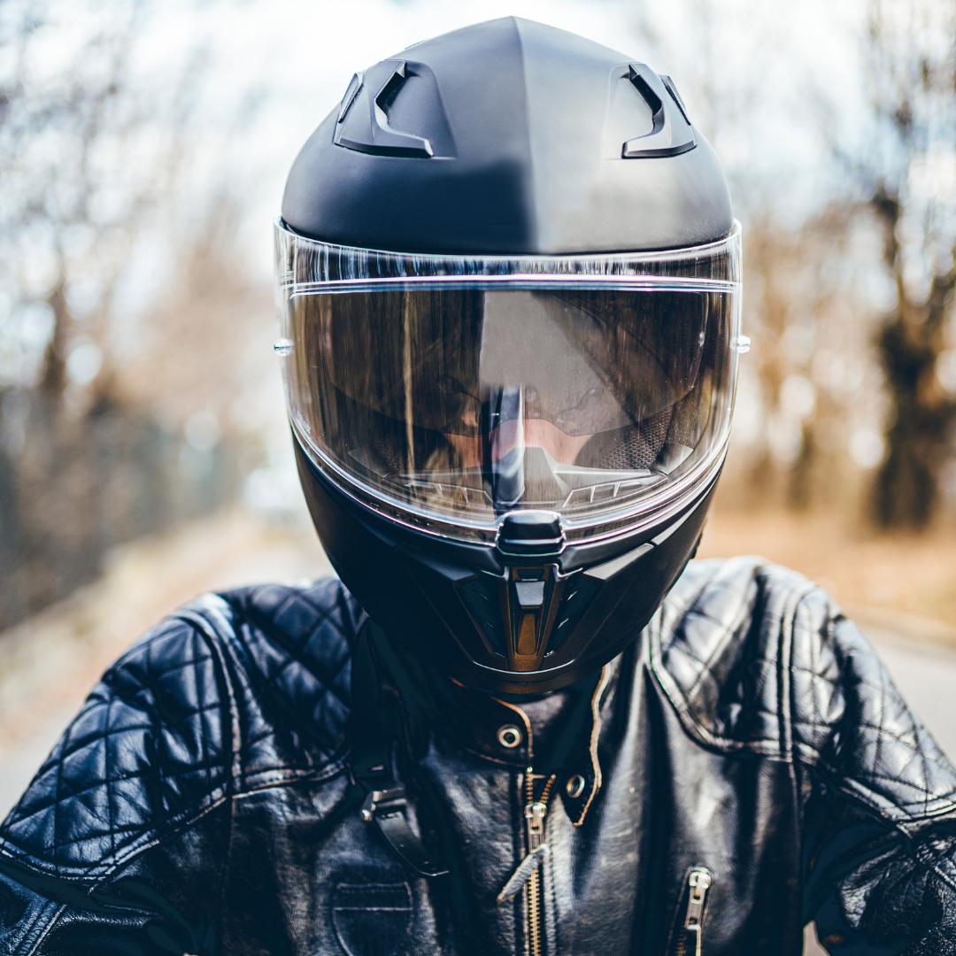 A man finding the perfect motorcycle helmet.